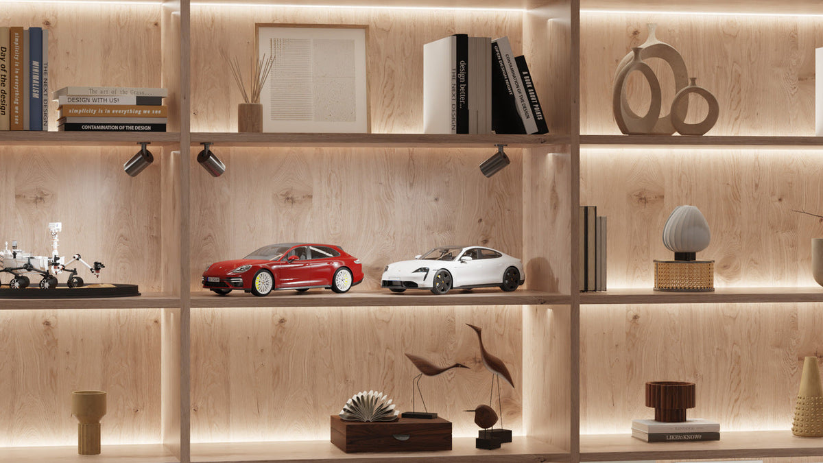Linear cabinet lighting illuminating several timber display shelves.